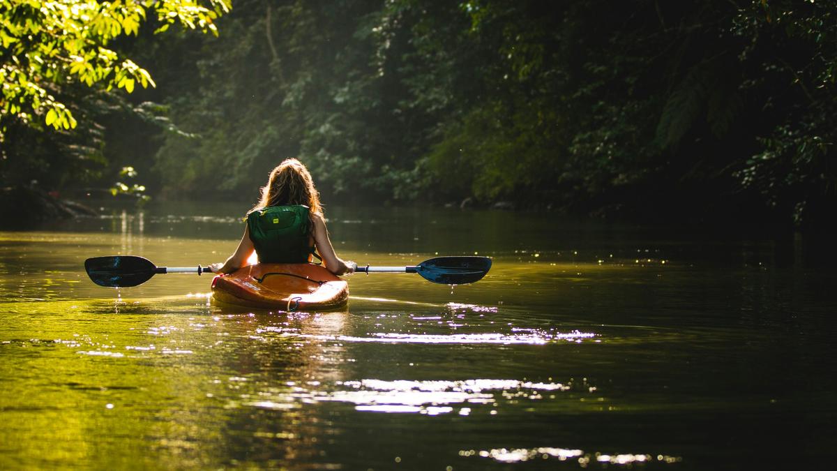 A girl goes kayaking on her own