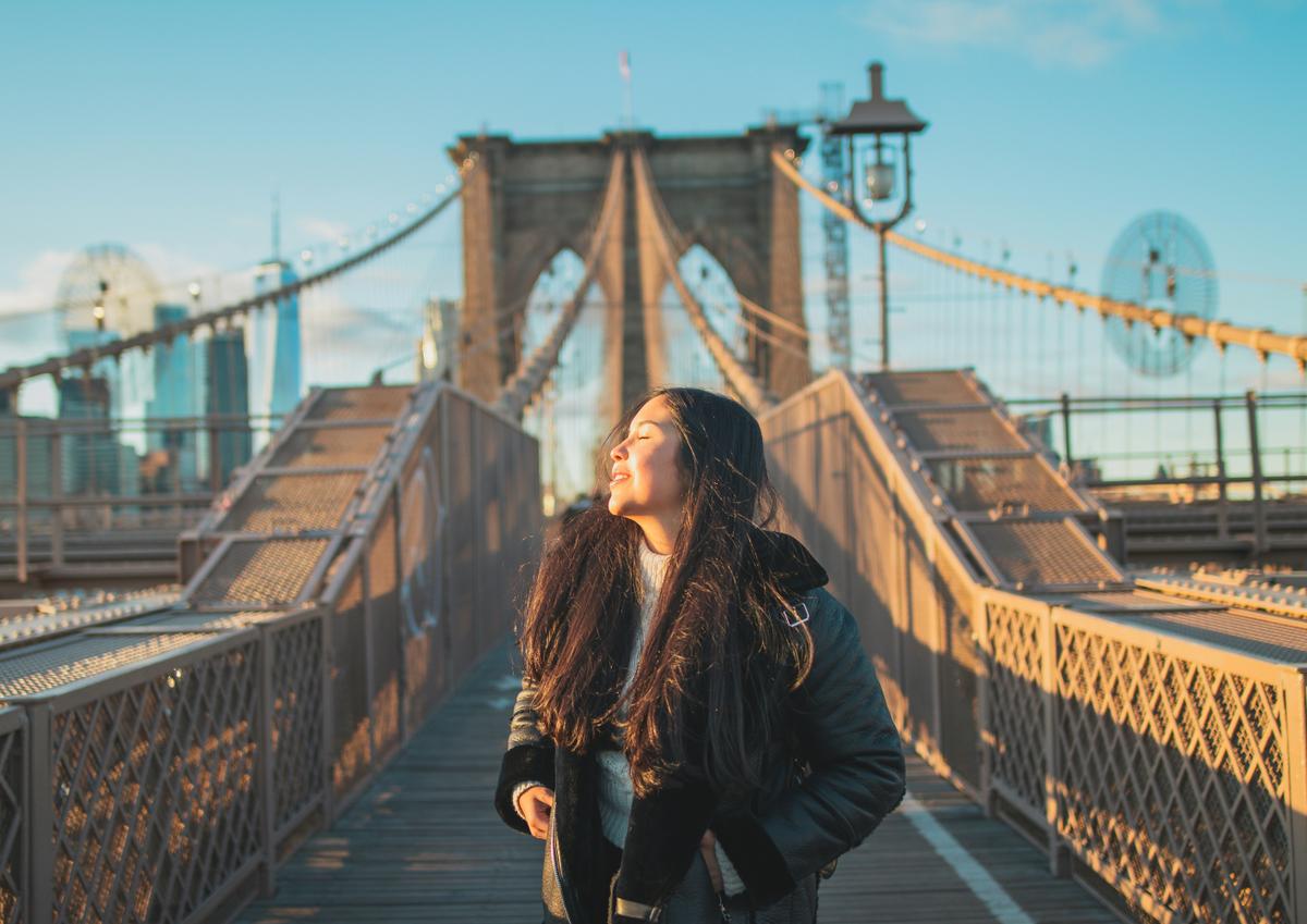 A girl enjoys the sun on a trip