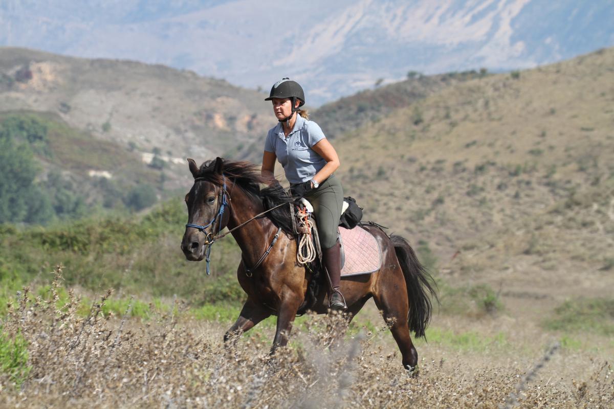 A woman riding a horse in Albania