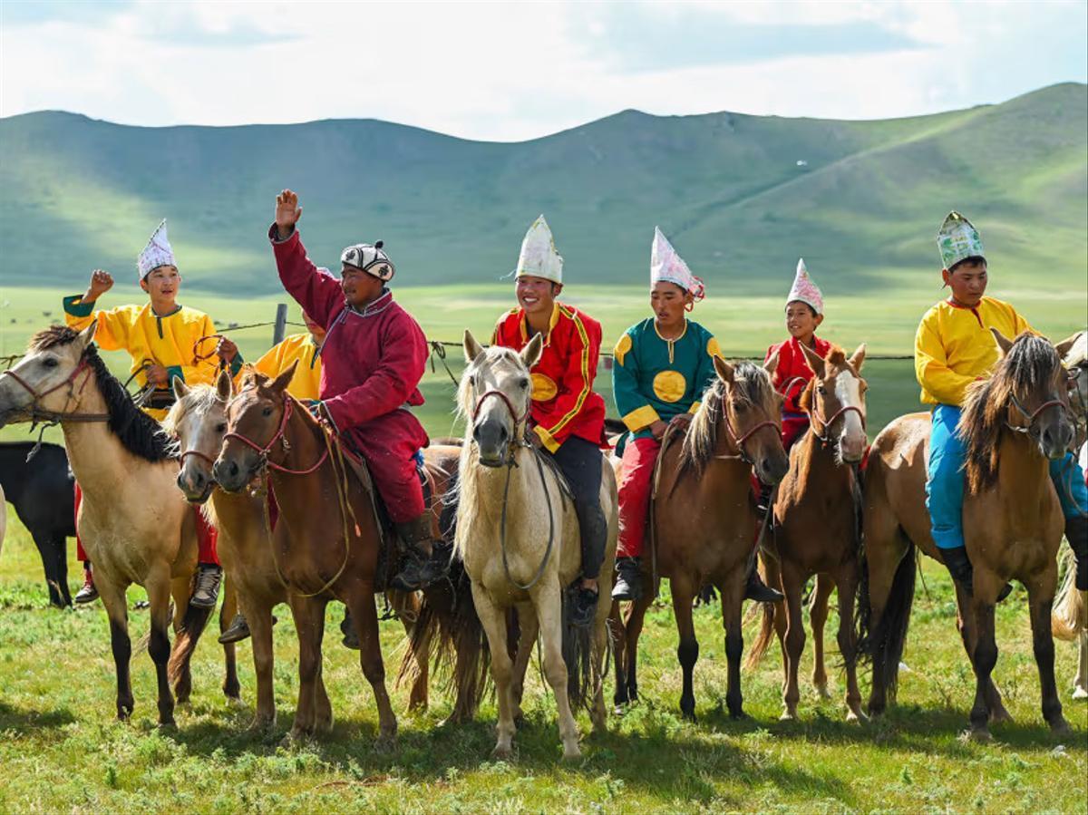 Nomadic people of Mongolia riding horses