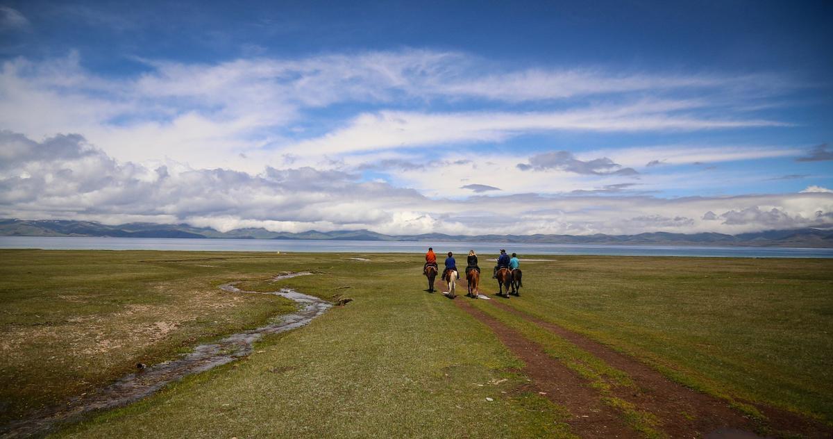 A group of tourists on horseback in Kyrgyzstan