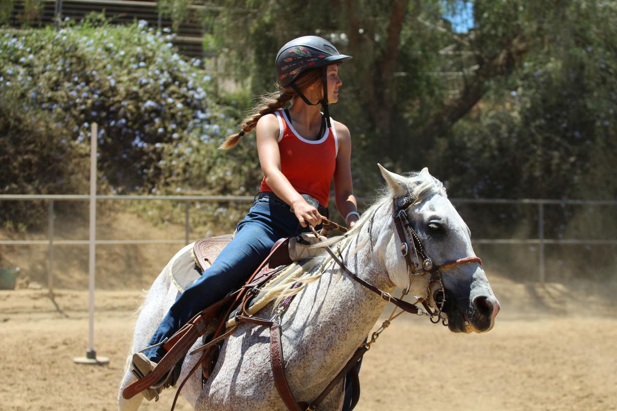 A girl riding a horse